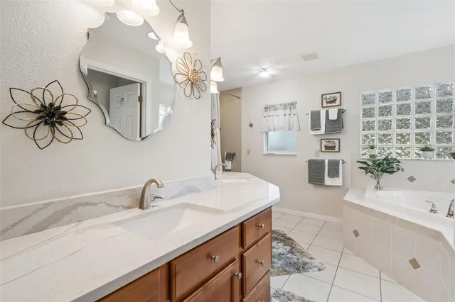 a view of a swimming pool with a patio and a yard