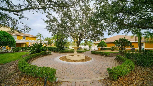 a swimming pool with outdoor seating and yard