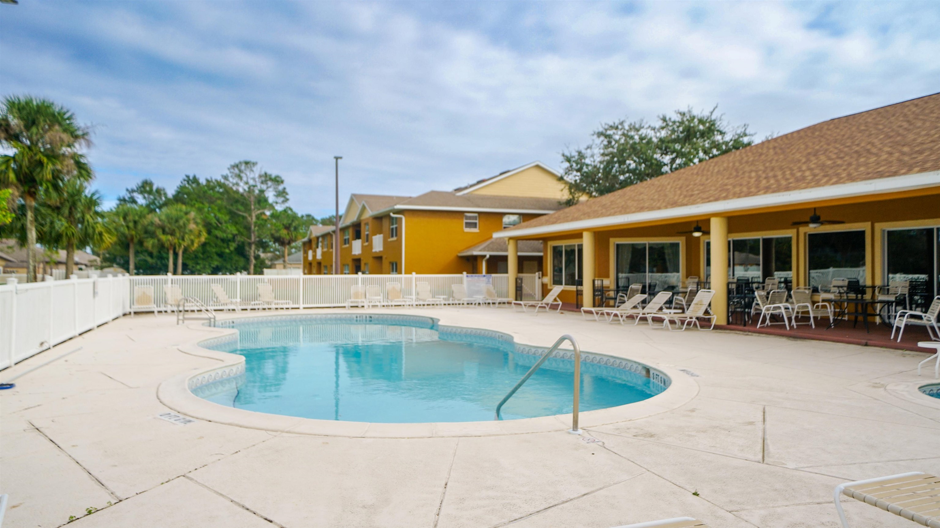 4600 East Moody Boulevard, Unit 8P Bunnell, FL 32110 - Photo 25 of 32 a view of a swimming pool with sitting area
