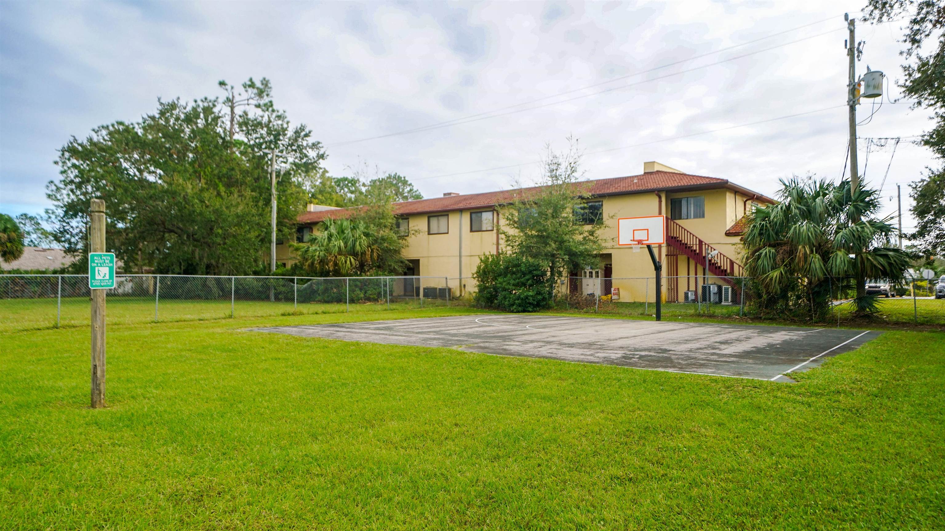 4600 East Moody Boulevard, Unit 8P Bunnell, FL 32110 - Photo 29 of 32 a view of a house with a yard