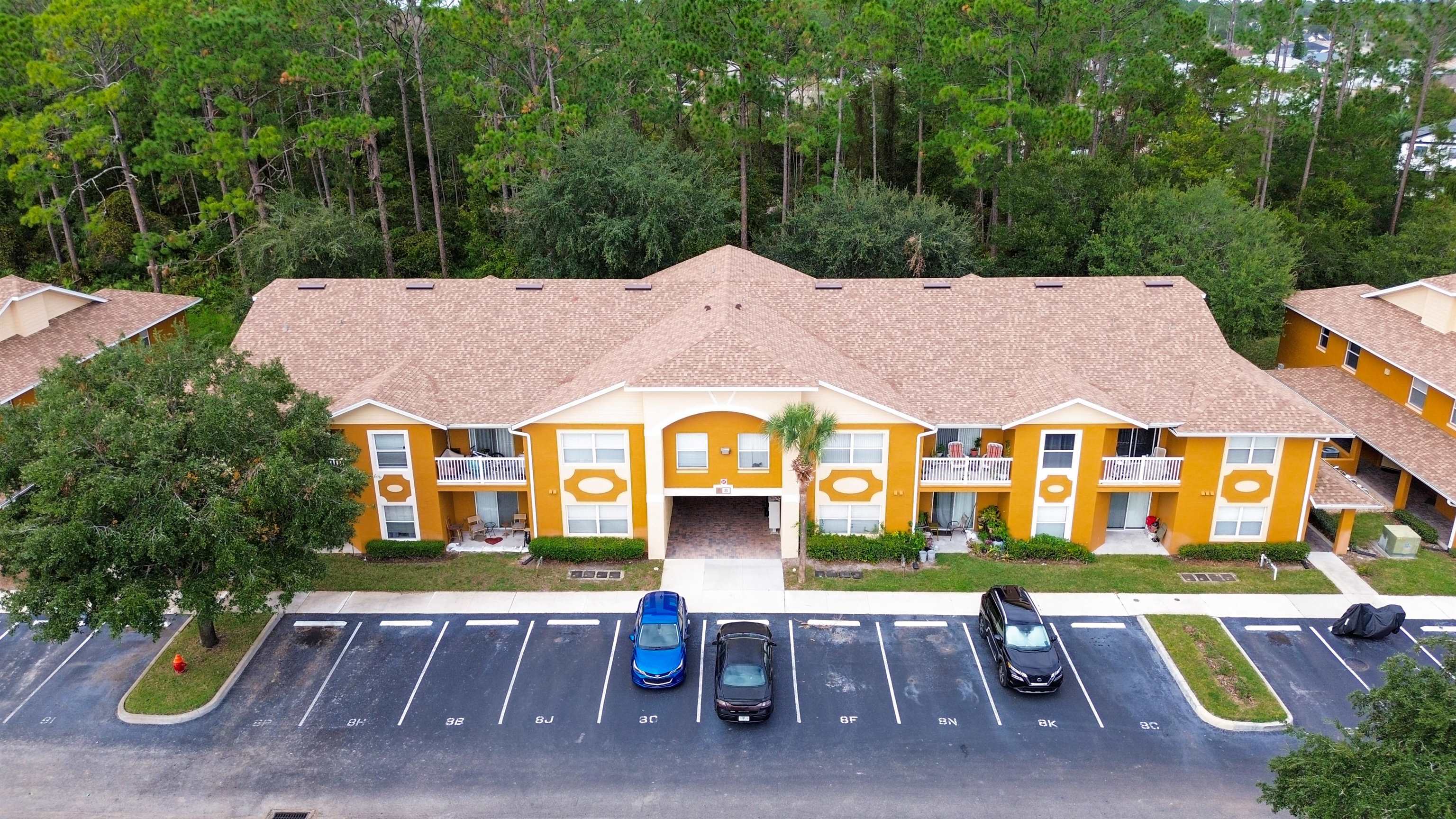 4600 East Moody Boulevard, Unit 8P Bunnell, FL 32110 - Photo 31 of 32 a aerial view of a house with a swimming pool