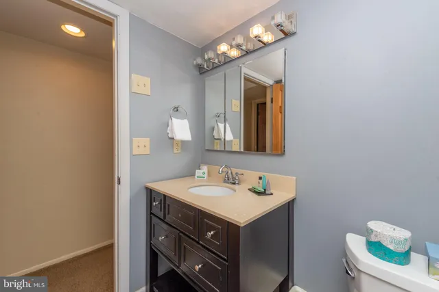 a spacious bedroom with a bed and a couch