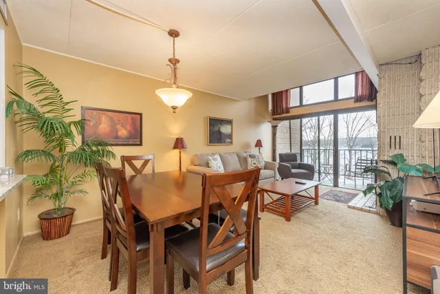 a view of a dining room with furniture window and outside view