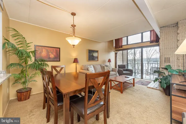 a view of a dining room with furniture window and outside view