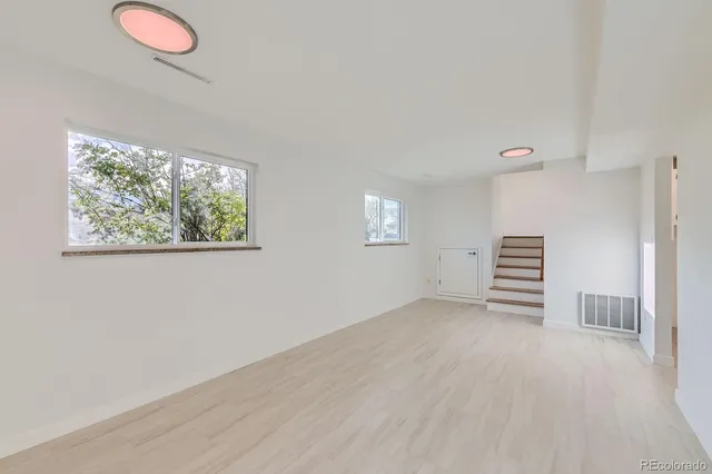 a view of room with stairs and a window
