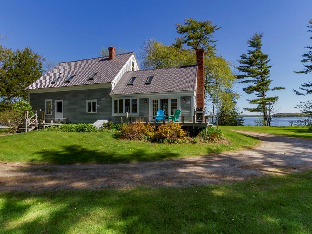 643 Browns Point Road Bowdoinham, ME 04008 - Photo 3 of 32 The back of the house with an ample...