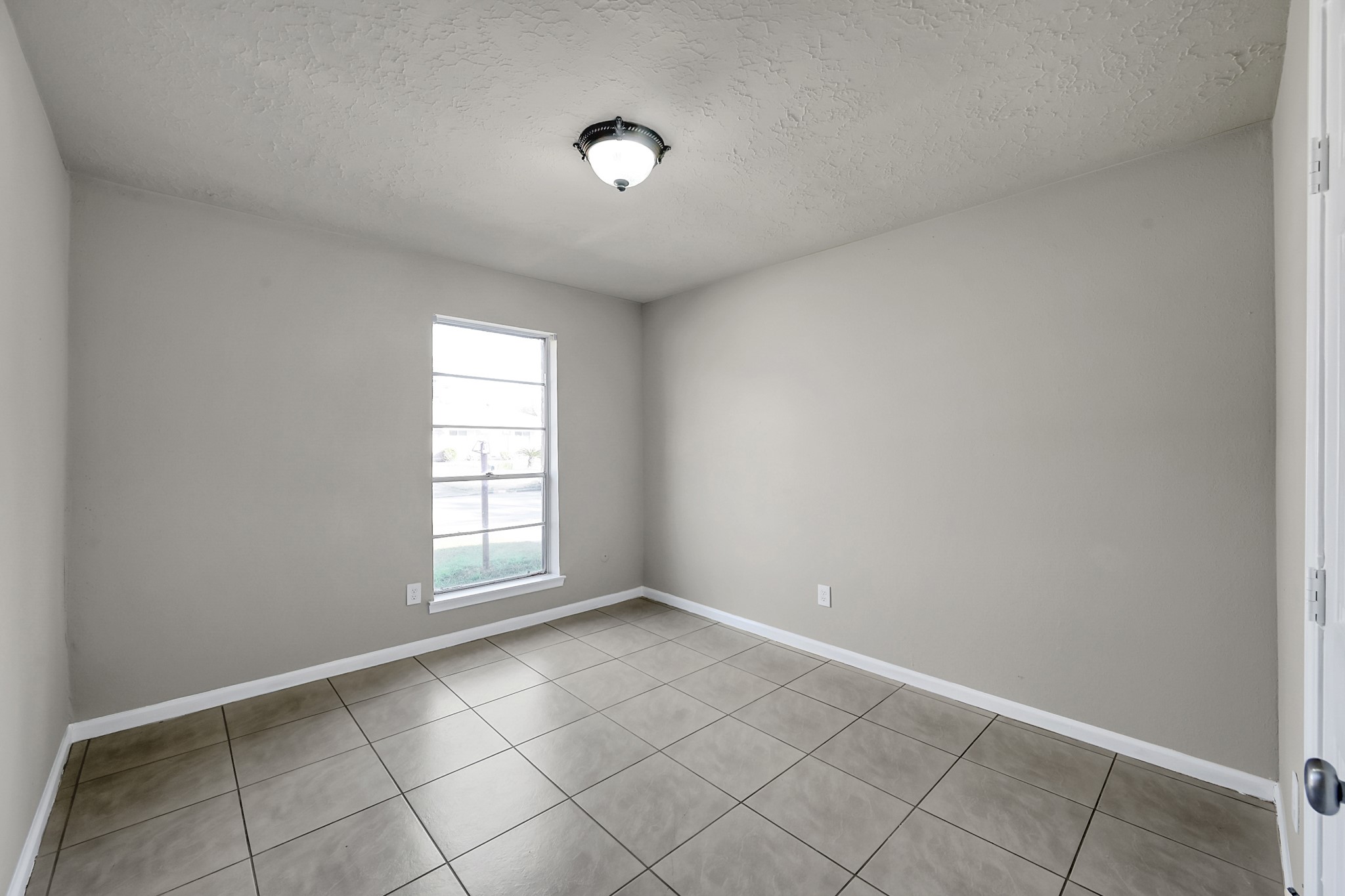 4310 Enchantedgate Drive Spring, TX 77373 - Photo 17 of 39 Generously sized secondary bedroom facing the front yard. 10' x 14'