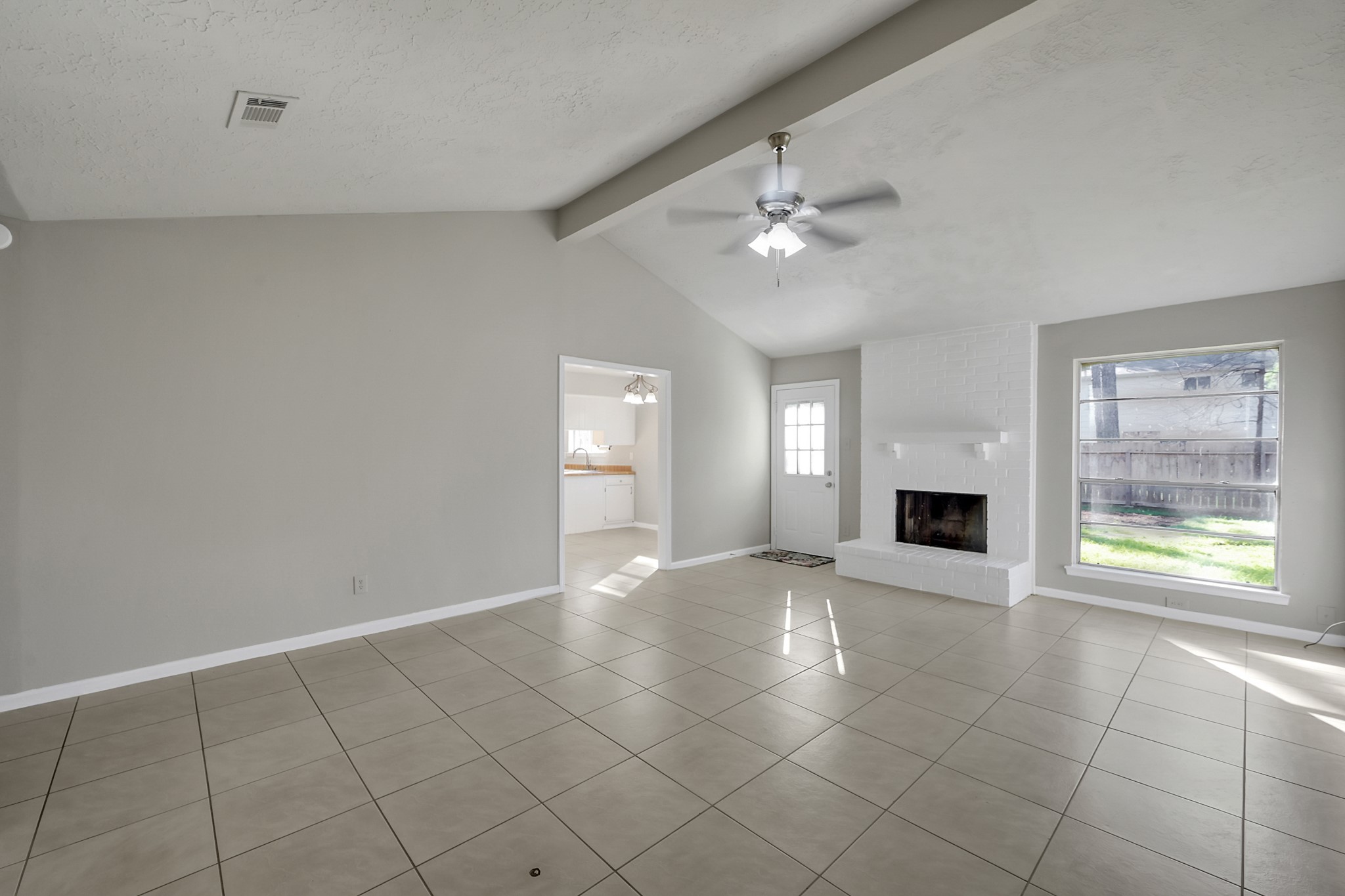 4310 Enchantedgate Drive Spring, TX 77373 - Photo 4 of 39 Light filled family room featuring a wood burning fireplace.