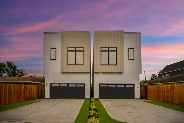 a front view of a house with parking area