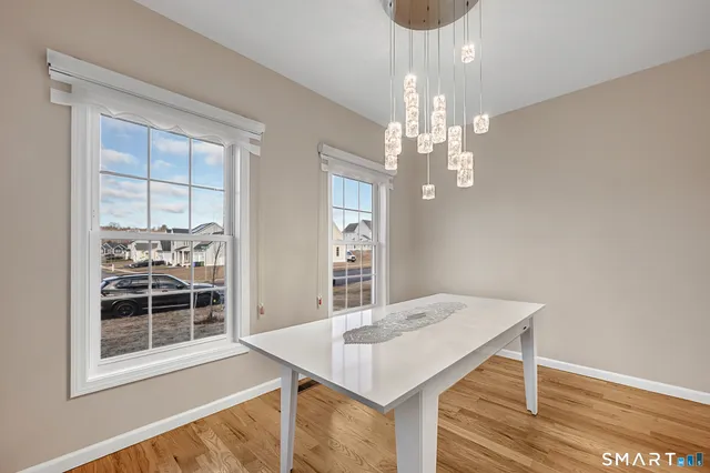 a bed sitting in a room next to a window
