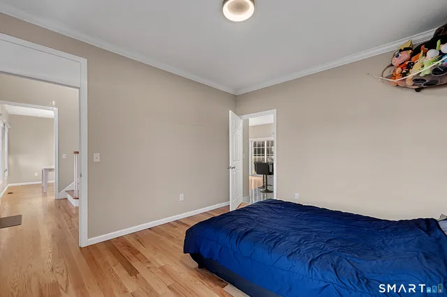 a bed room with a bed and a television