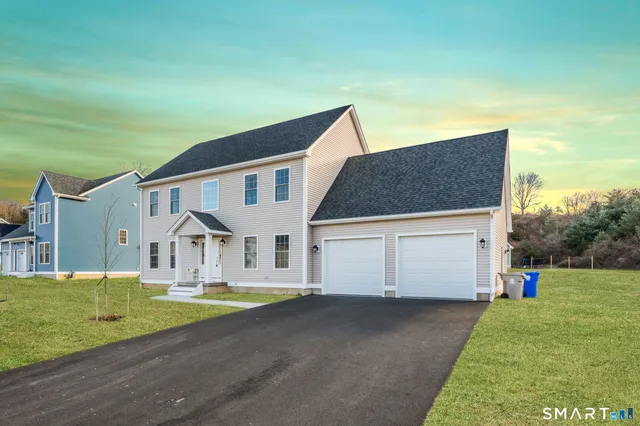 a front view of a house with a yard