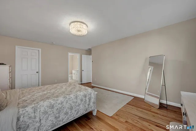 a view of a white car parked in front of a house