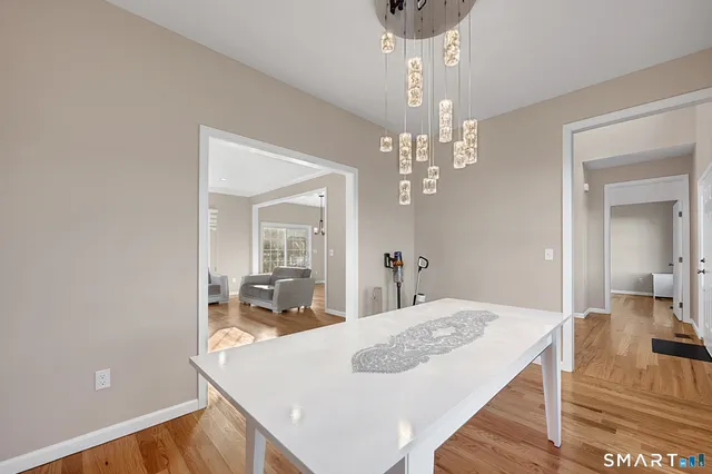 a view of a dining room with furniture and window