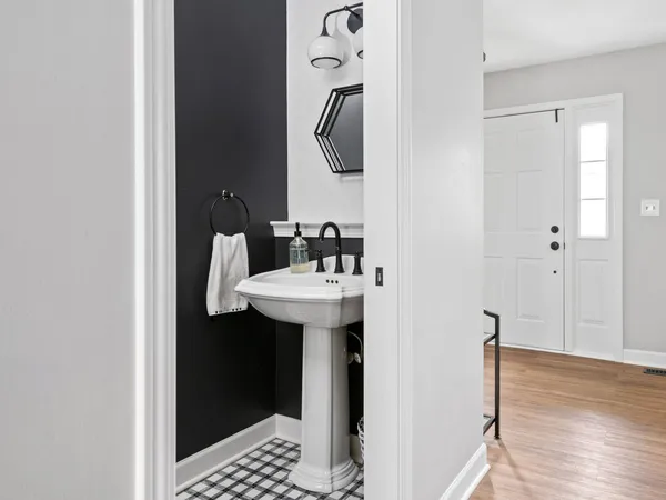 a bathroom with a sink and mirror