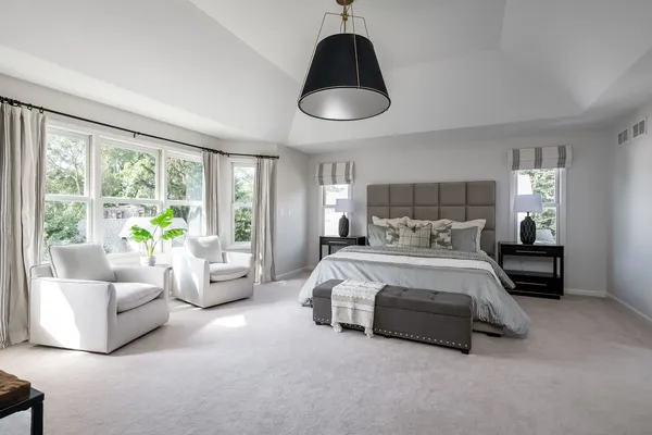 a bed room with a bed and a couch