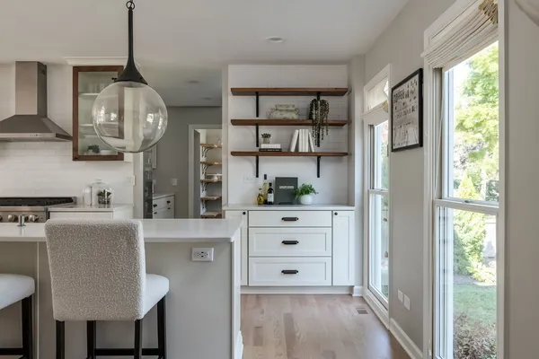 a kitchen with stainless steel appliances a refrigerator and cabinets