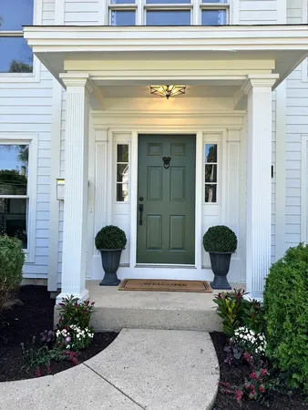a front view of a house with a yard