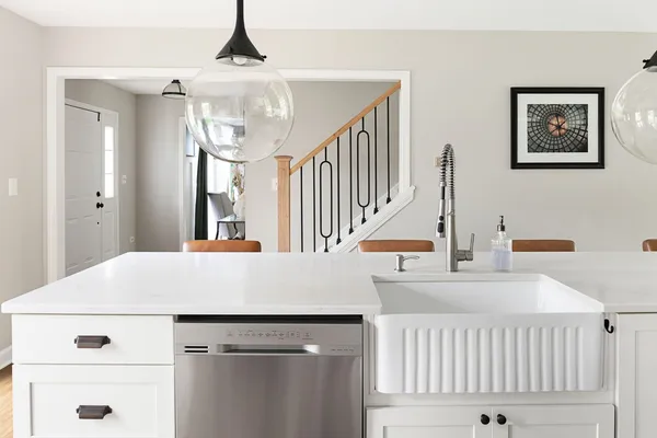 a view of entryway and hall with a front door