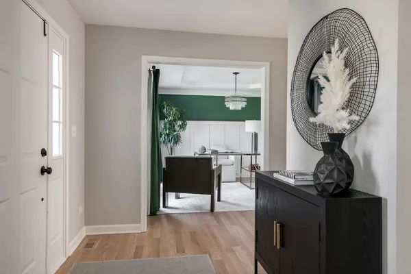 a view of a livingroom with furniture and wooden floor