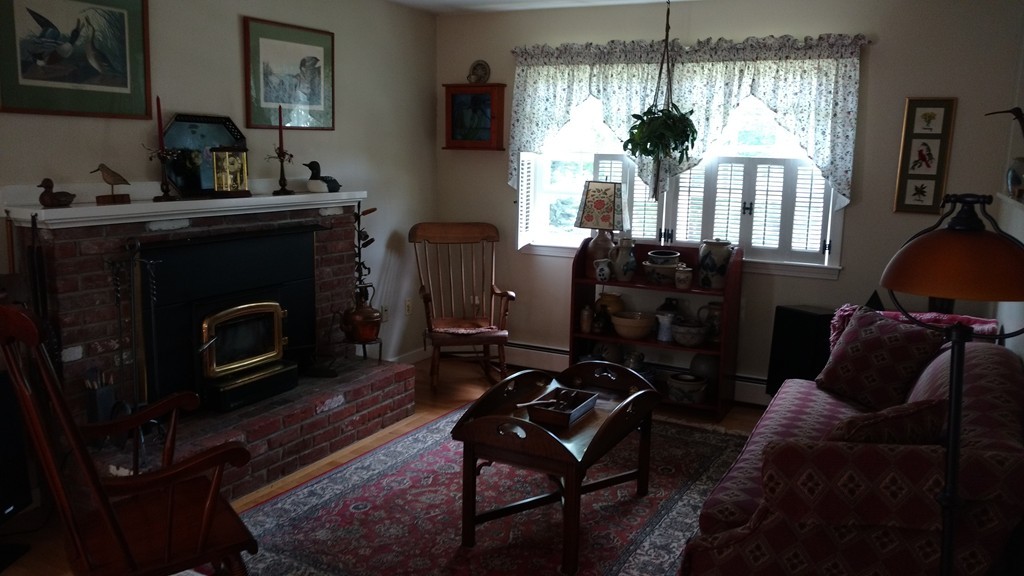 841 Dennison Drive Southbridge, MA 01550 - Photo 15 of 28 a living room with furniture a flat screen tv and a fireplace