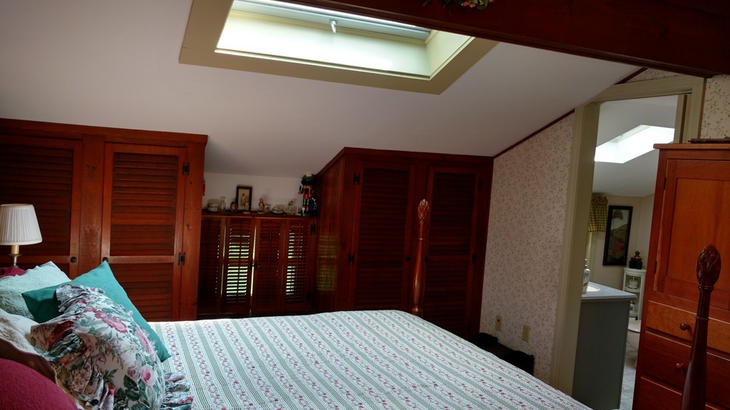 841 Dennison Drive Southbridge, MA 01550 - Photo 16 of 28 a bedroom with a bed and wooden floor