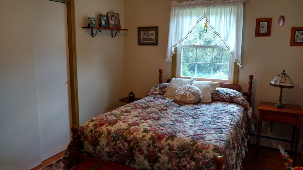 841 Dennison Drive Southbridge, MA 01550 - Photo 17 of 28 a bedroom with a bed and a window