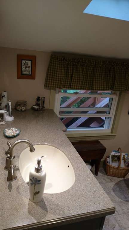 841 Dennison Drive Southbridge, MA 01550 - Photo 18 of 28 a bathroom with a granite countertop sink and mirror