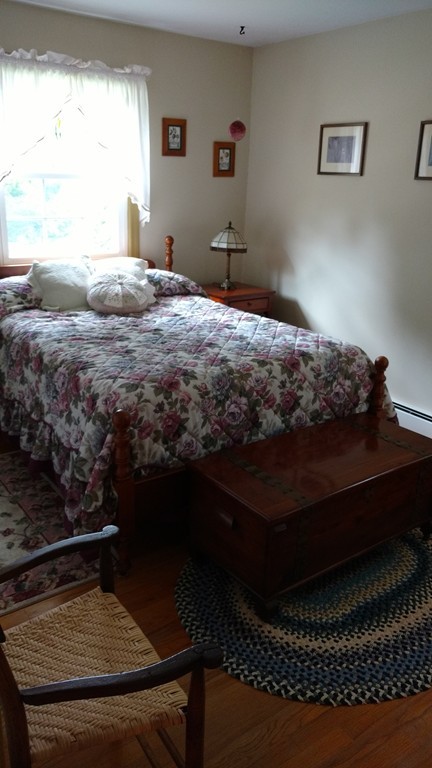841 Dennison Drive Southbridge, MA 01550 - Photo 19 of 28 a bedroom with a bed rug and window