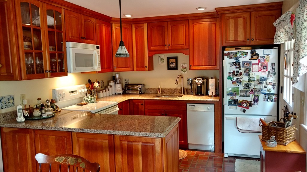 841 Dennison Drive Southbridge, MA 01550 - Photo 2 of 28 a kitchen with stainless steel appliances granite countertop a refrigerator a sink and wooden cabinets