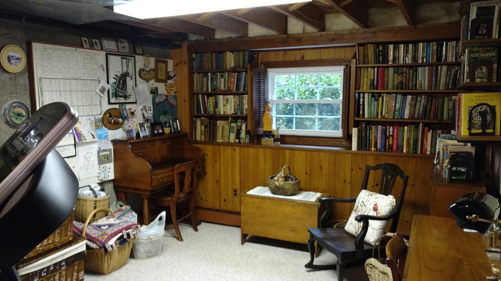 841 Dennison Drive Southbridge, MA 01550 - Photo 22 of 28 a view of a workspace with furniture and a bookshelf