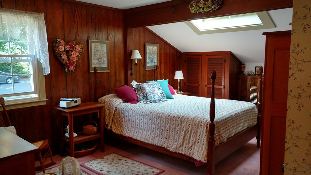 841 Dennison Drive Southbridge, MA 01550 - Photo 4 of 28 a bedroom with a bed table and window