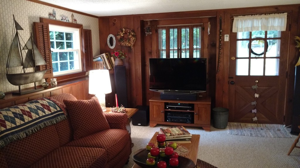 841 Dennison Drive Southbridge, MA 01550 - Photo 5 of 28 a living room with furniture a window and a flat screen tv