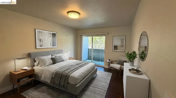 a bedroom with a bed and a couch