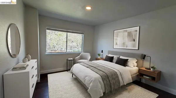 a bedroom with bed and a window