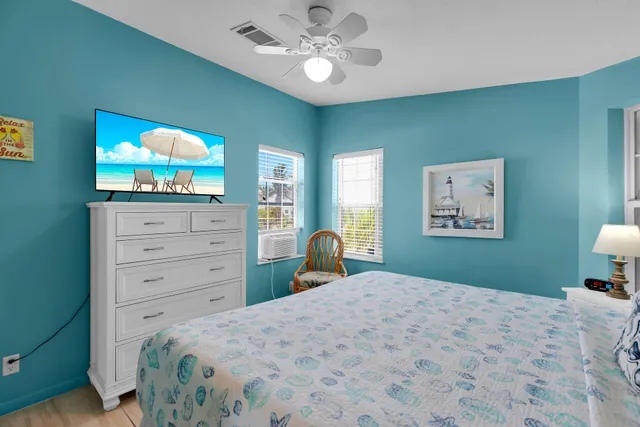 a bedroom with a bed and a lamp