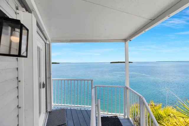 a view of balcony with wooden floor