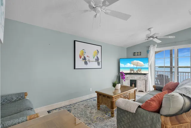 a kitchen with stainless steel appliances kitchen island granite countertop a table and chairs in it