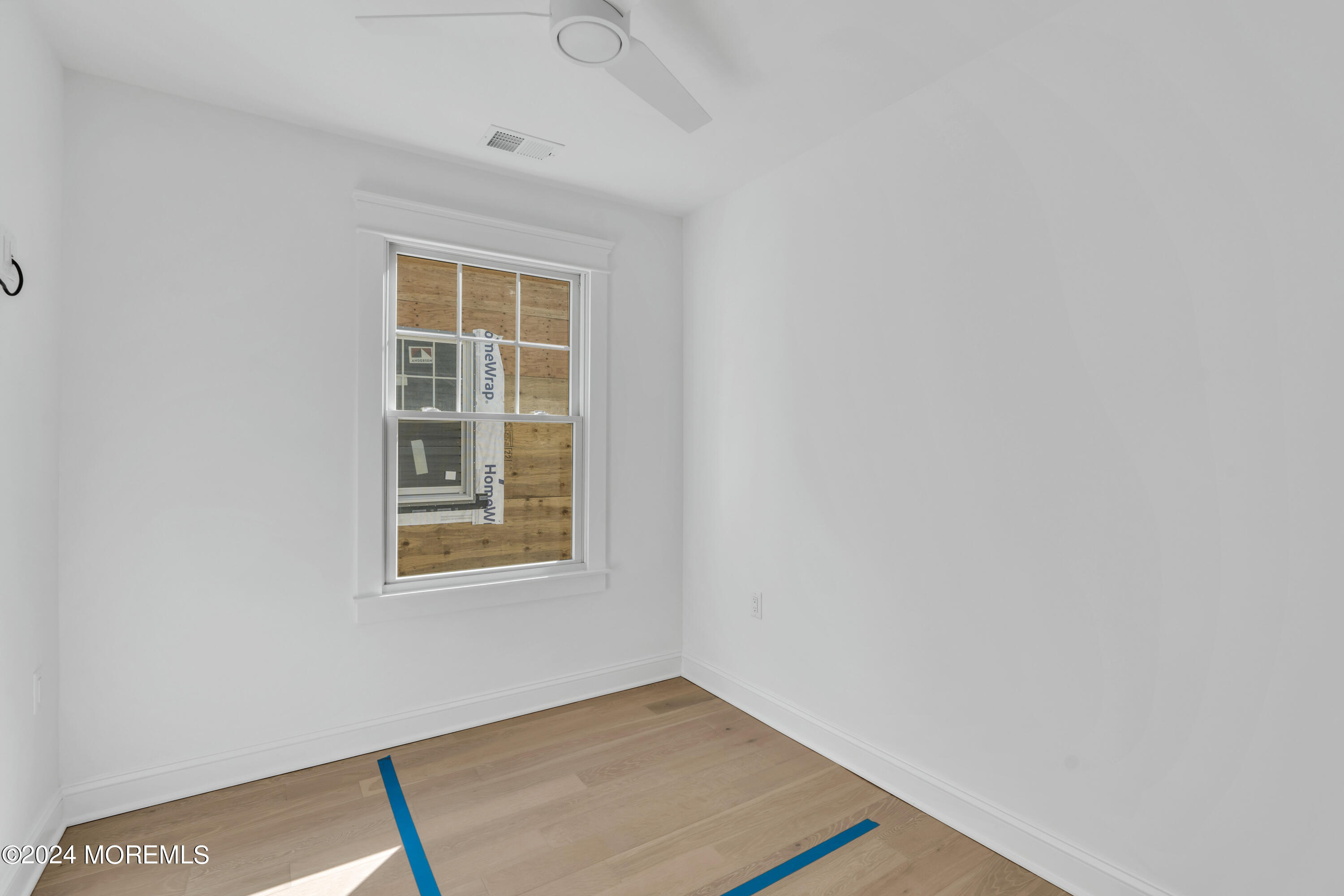 7 Shell Road, Unit 133 Mantoloking, NJ 08738 - Photo 23 of 44 a view of an empty room with a window