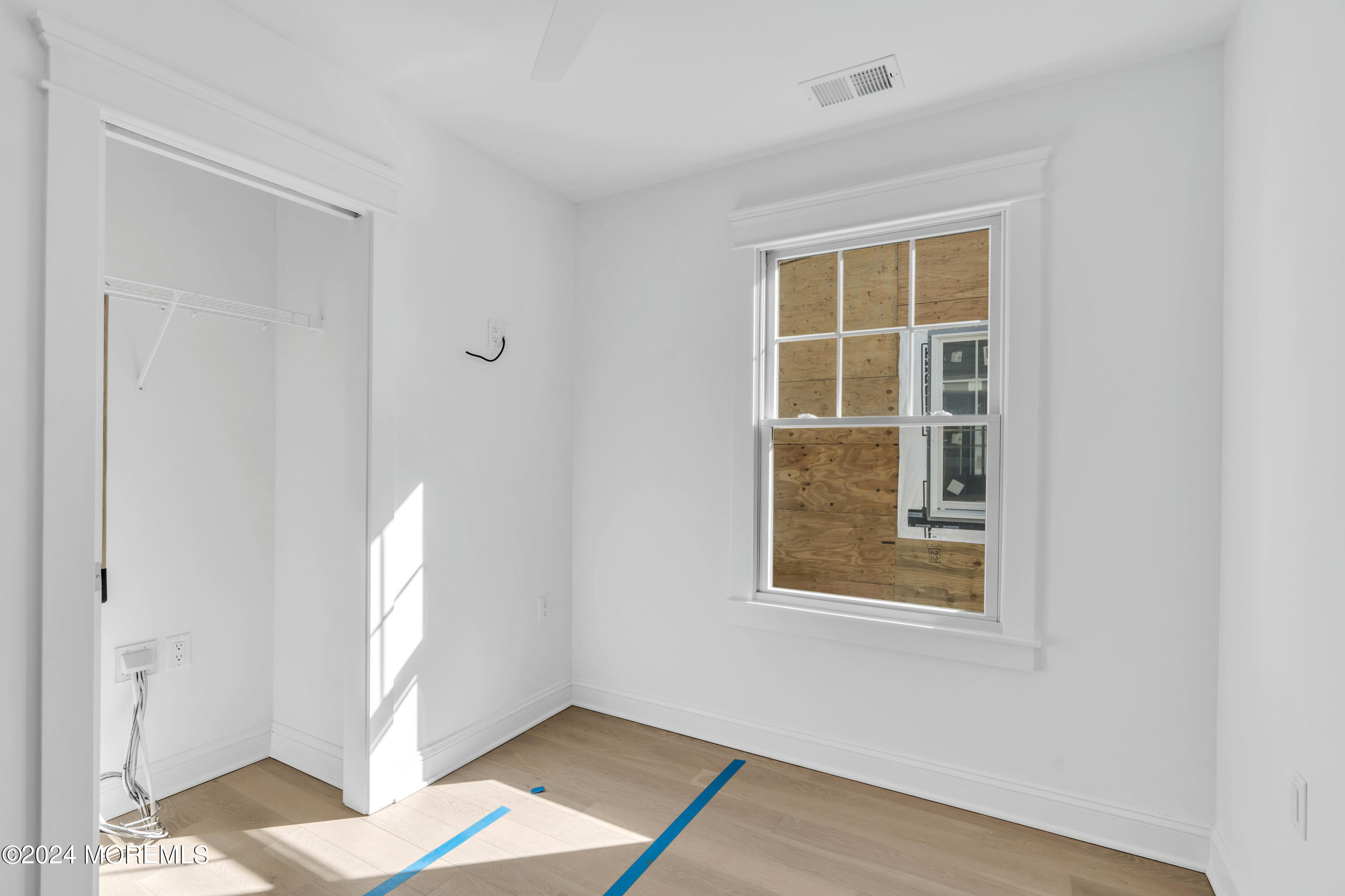 7 Shell Road, Unit 133 Mantoloking, NJ 08738 - Photo 24 of 44 a view of an empty room with a window