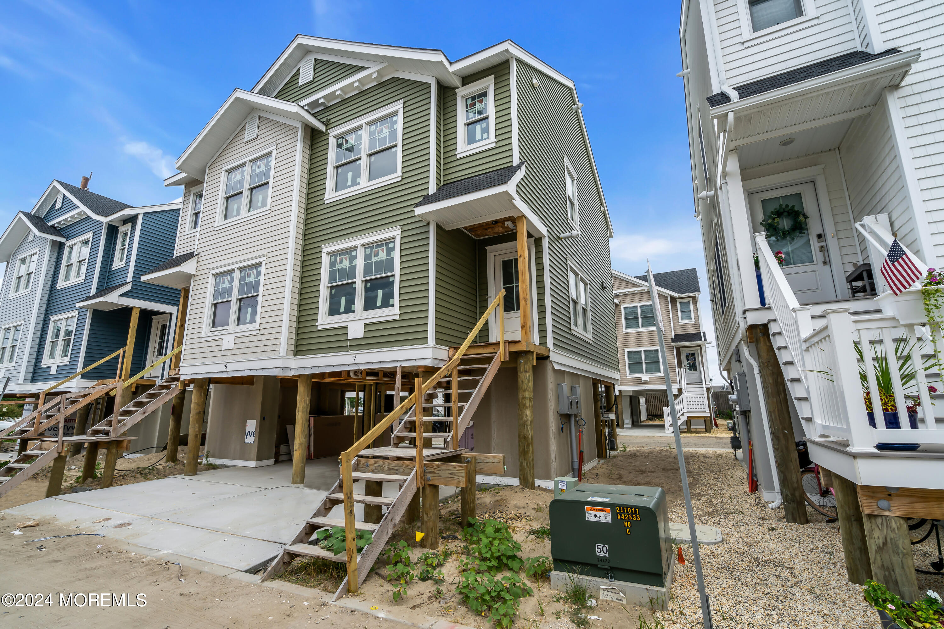 7 Shell Road, Unit 133 Mantoloking, NJ 08738 - Photo 3 of 44 a front view of a house with many windows