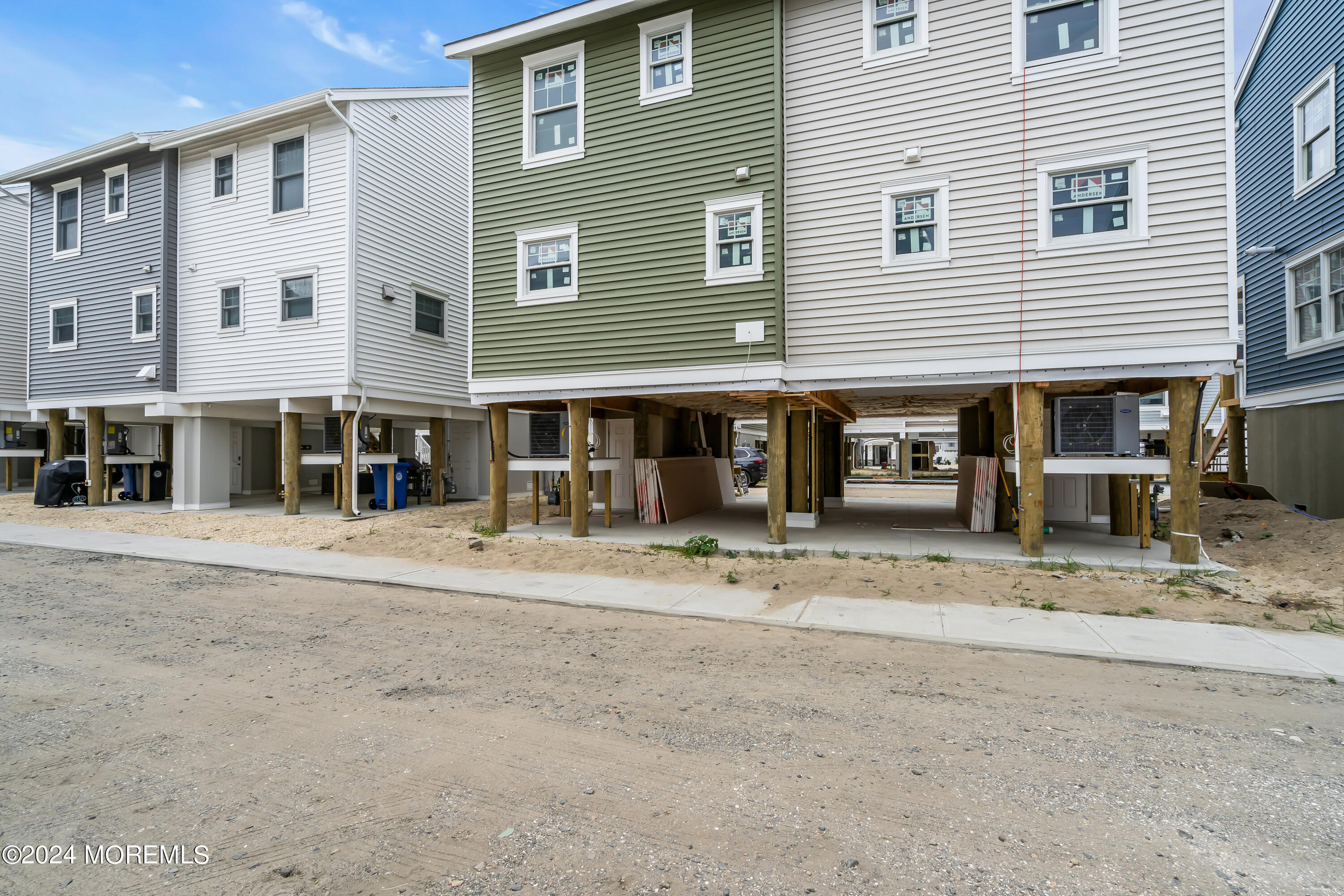 7 Shell Road, Unit 133 Mantoloking, NJ 08738 - Photo 40 of 44 a front view of a house with a garden and patio