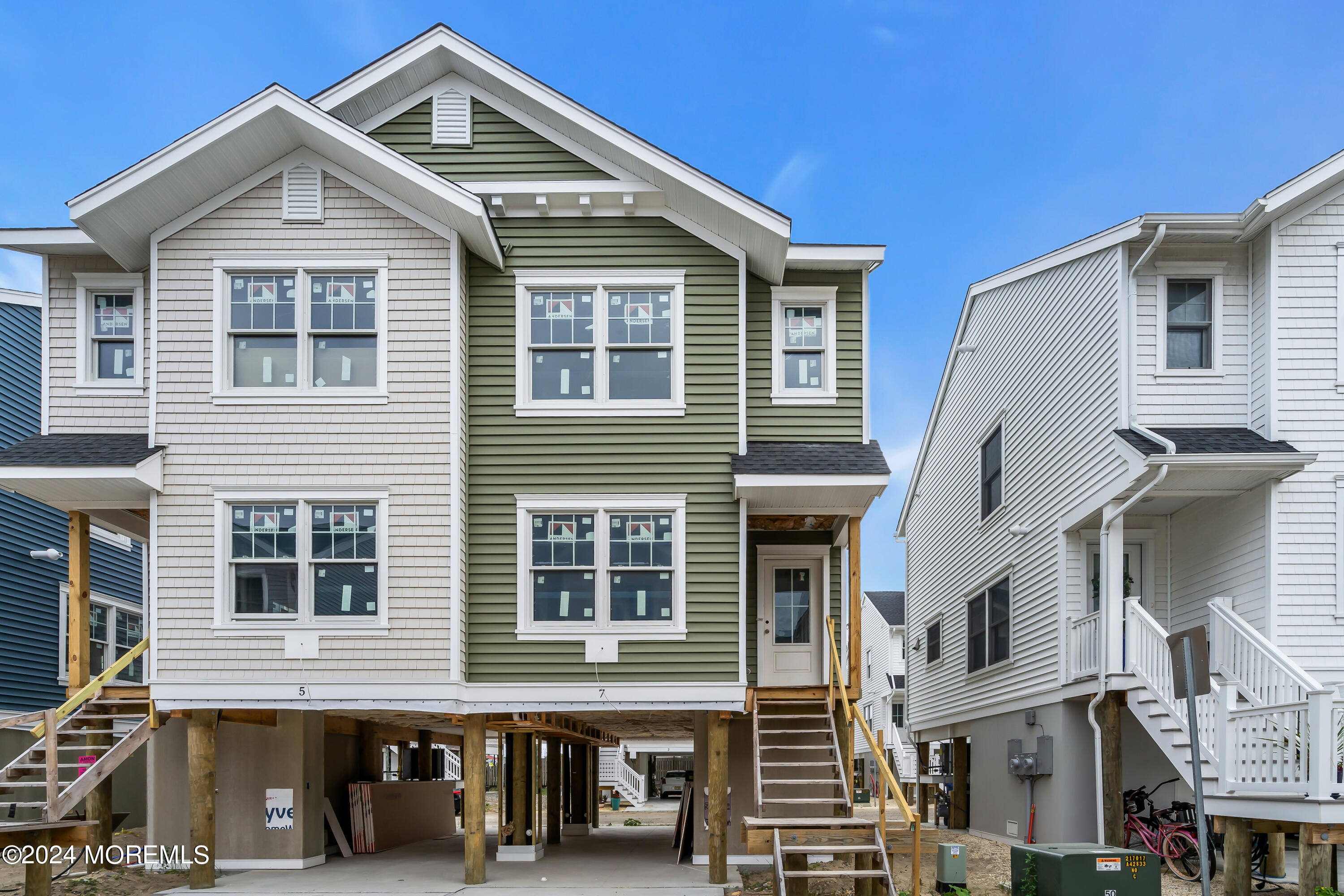7 Shell Road, Unit 133 Mantoloking, NJ 08738 - Photo 4 of 44 a front view of a residential apartment building with a door