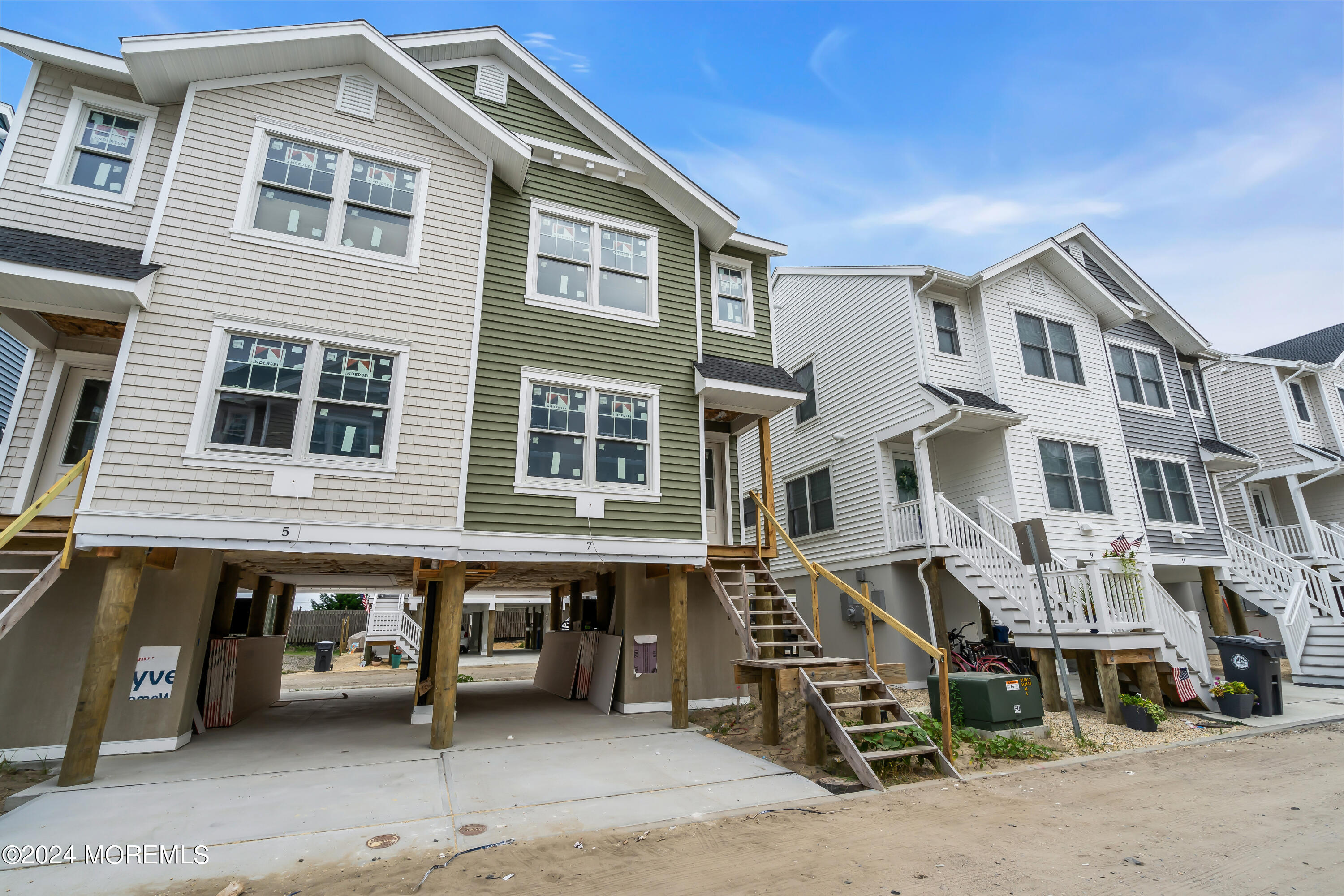 7 Shell Road, Unit 133 Mantoloking, NJ 08738 - Photo 7 of 44 a front view of a house with a parking space