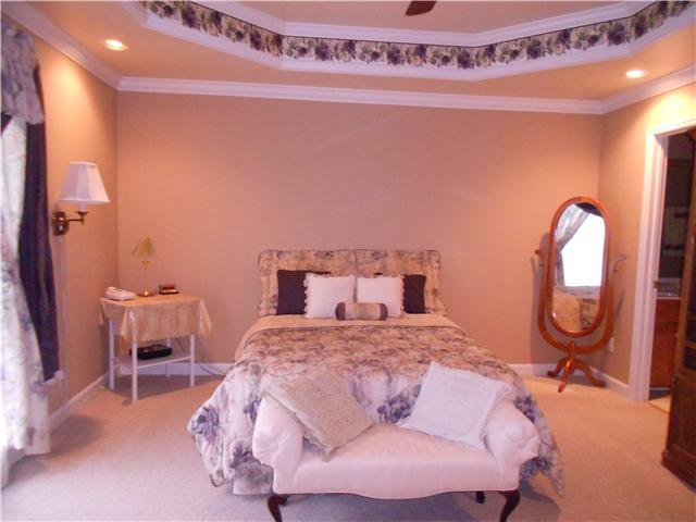 7296 Old Franklin Road Fairview, TN 37062 - Photo 5 of 18 Master Bedroom located on the left side of the entry foyer, full of natural light.