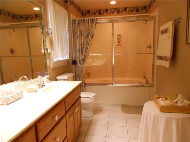 7296 Old Franklin Road Fairview, TN 37062 - Photo 6 of 18 Master Bath boasts a double vanity with a tub and shower combo.