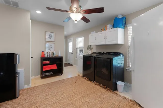 a view of a bathroom with a shower and a sink
