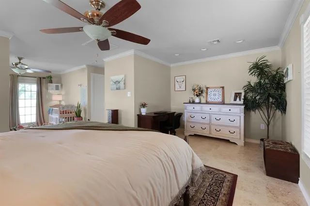 a living room with furniture ceiling fan and a window