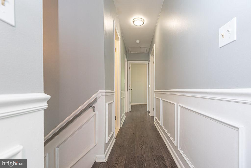 63 Drawbridge Road Ocean Pines, MD 21811 - Photo 49 of 102 a view of a hallway with wooden floor and staircase