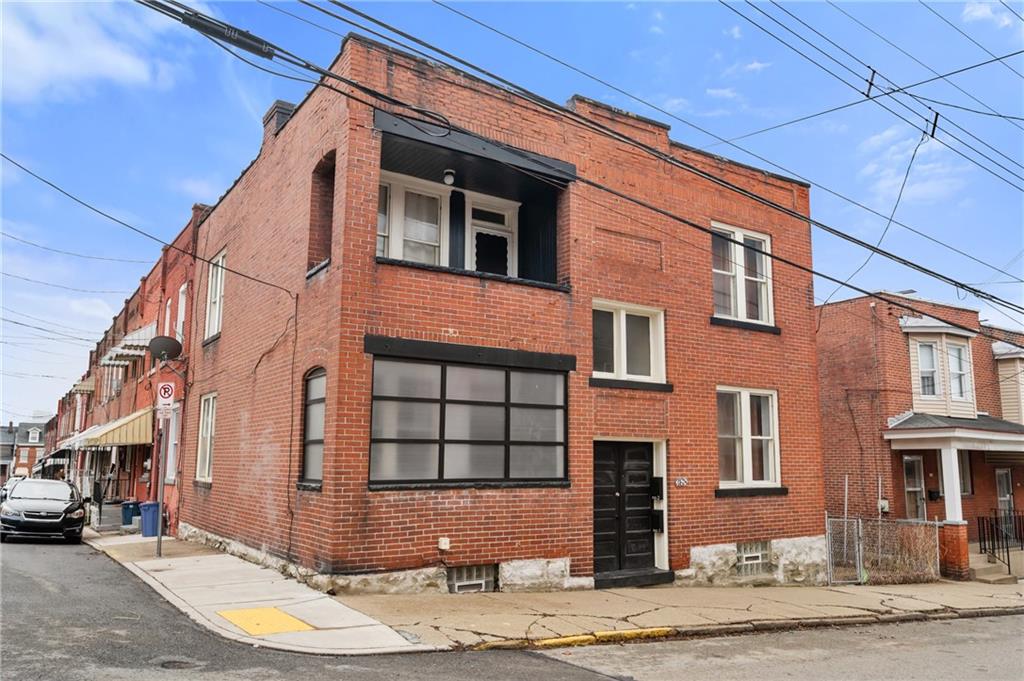 368 44th Street Pittsburgh, PA 15201 - Photo 1 of 39 a front view of a building with a road